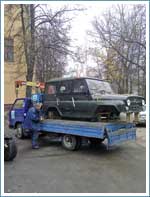 Перевозка кузова автомобиля УАЗ маленьким манипулятором на территори НАМИ.